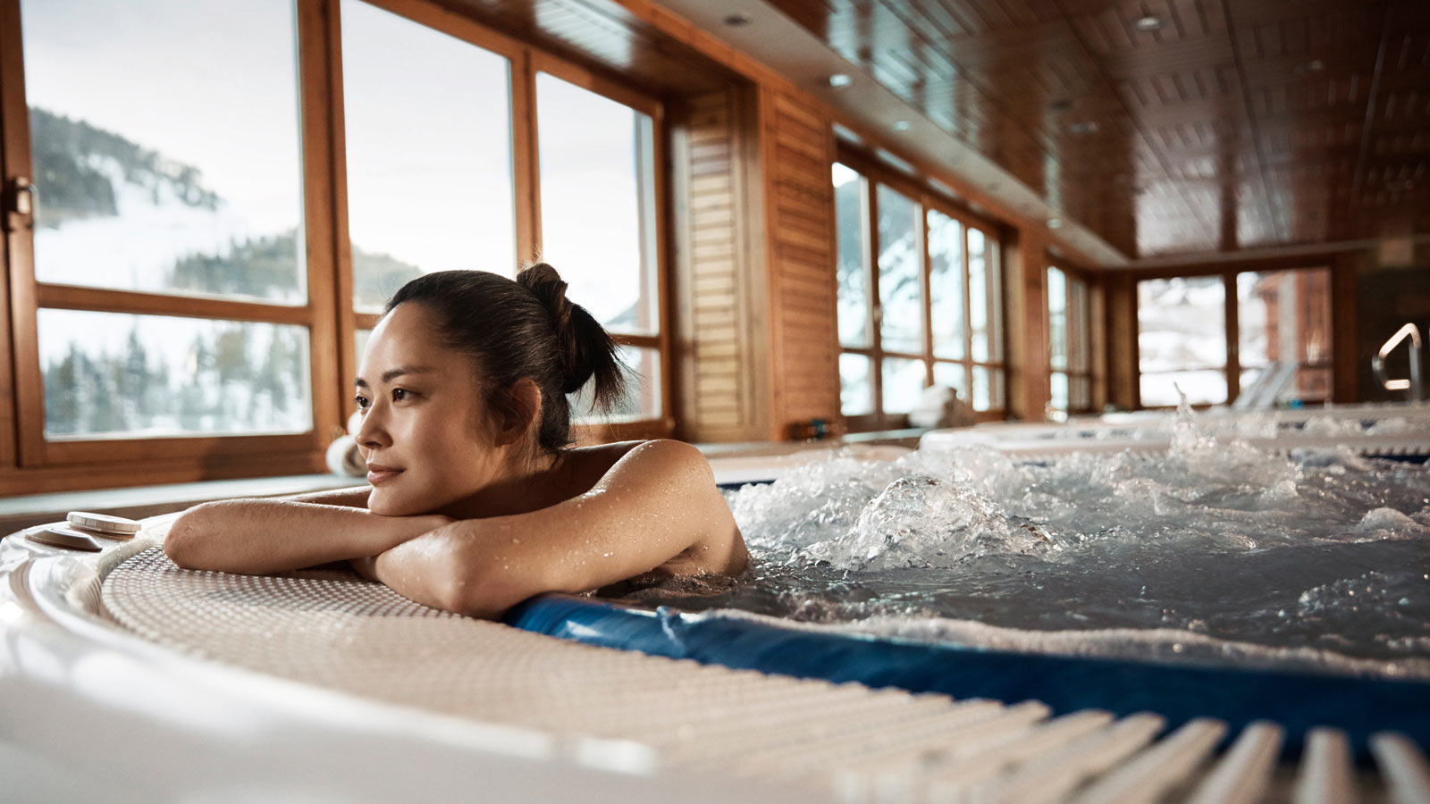 asian lady relaxing in a jacuzzi